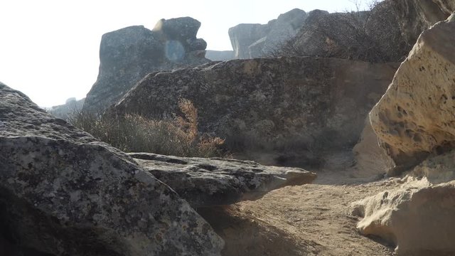 Gobustan is the national reserve of Azerbaijan. Petroglyphs of the ancient inhabitants of the planet. Ancient rock carvings, wild mountain landscapes, mountains and tourists.