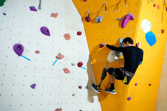 Amputee conquering climbing wall