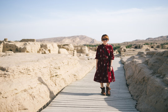 young lady  in site of an ancient city