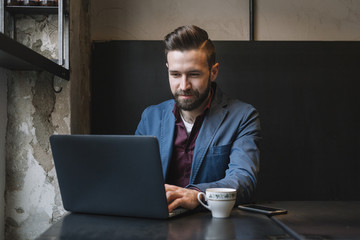 Cheerful man at the laptop