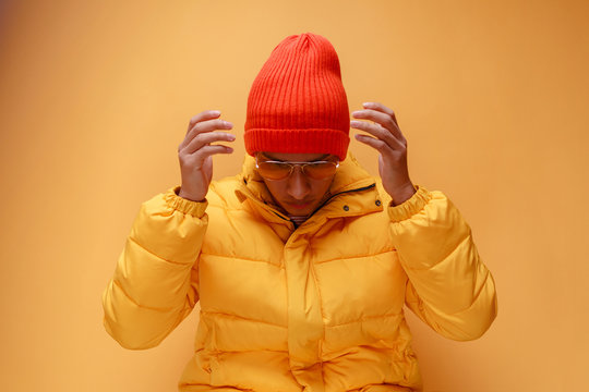 Young man with puffer jacket and knit cap