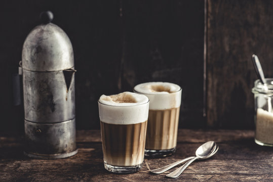 Coffee: Latte macchiato, espresso and foamed milk in glasses