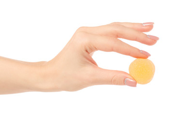 Fruit jelly in sugar in hand