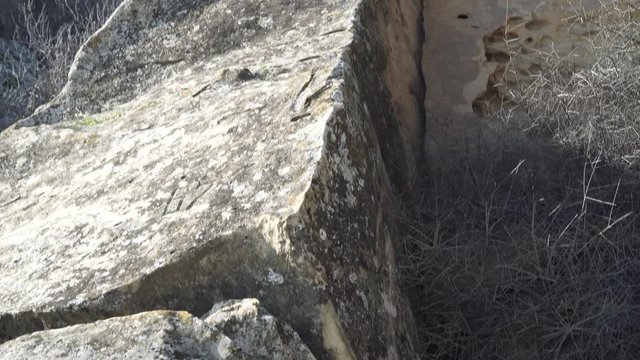 Gobustan is the national reserve of Azerbaijan. Petroglyphs of the ancient inhabitants of the planet. Ancient rock carvings, wild mountain landscapes, mountains and tourists.