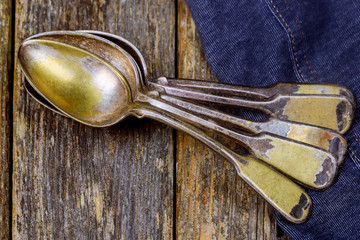 Old vintage spoons on wood table.Top view with copy space