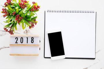 2018 wood box, blank notebook paper, smart phone with blank screen on white marble background, 2018 new year mock up, template, flat lay