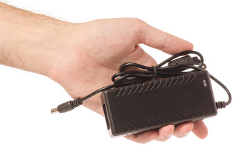 power supply laptop in hand isolation