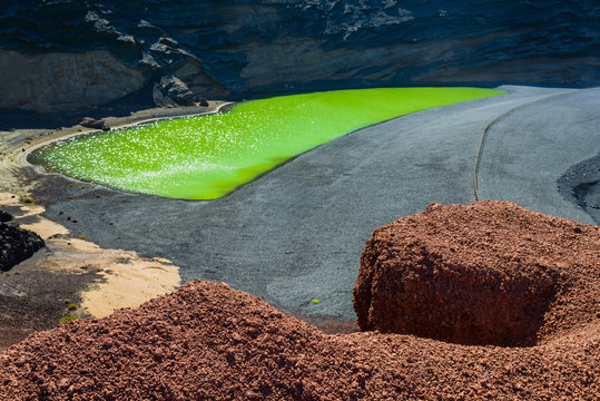 Volcanic green lake (El Lago Verde, Charco de los Clicos) in El Golfo. Lanzarote. Canary Islands. Spain