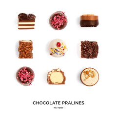 Seamless pattern with chocolate pralines. Abstract background. Chocolate pralines on the white background