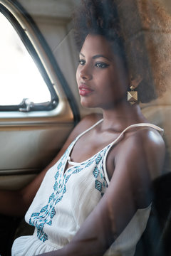 Beautiful African Woman Sitting Inside The Car