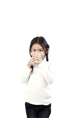Preschool girl holding a glass with milk