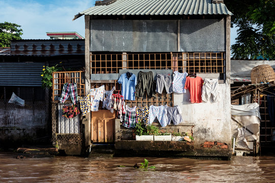 Laundry on an old house on the banks of the Mekong Delta