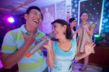Singing mature couple