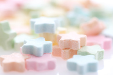 Colourful Star Milk pellets isolated in white background