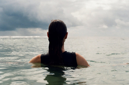 Back View Of A Woman In A Water