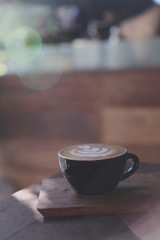 Cappuccino coffee break on wood background