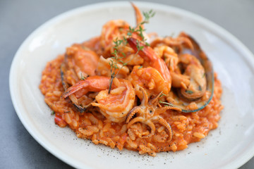 seafood risotto with mussel shrimp and squid , italian food