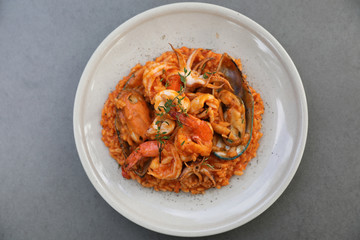 seafood risotto with mussel shrimp and squid , italian food