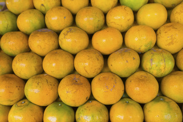 Tangerine stacked in layers.