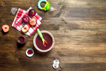Baby food. Baby puree from fresh plums.