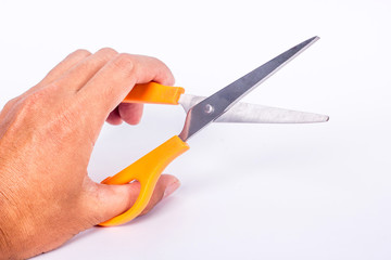 hand holding scissors