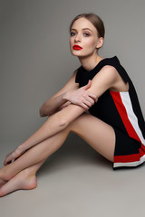 high fashion woman in short black dress.