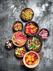 Multicolored candy, jelly and marshmallows in a bowl.