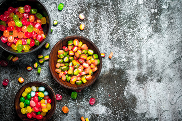 Fruit candies. On rustic background.