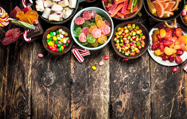 Different sweet candy, jelly, marshmallows and candied fruits.