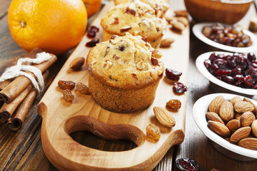 Obraz na płótnie Canvas Orange muffins with dried fruits
