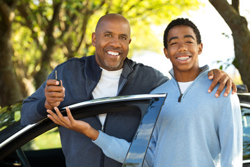 Father teaching his son how to drive.