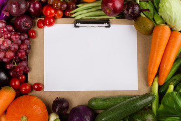 Top view of Fruits and Vegetable border with writing pad and paper for writing text, Salad Menu, Fresh produce, restaurant and vegetarian concept.