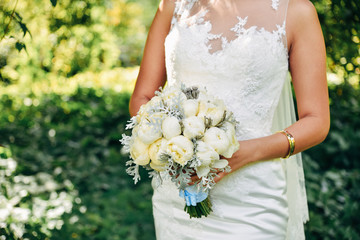Wedding bouquet on bride hand