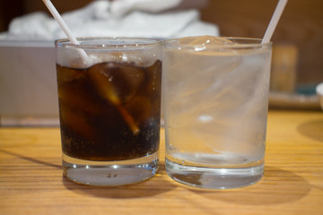 Soft drink and water in glass