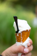 Hand holding Ice cream melting