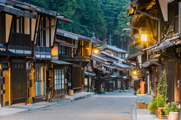 Obraz premium Narai-juku, Japan - September 4, 2017: Picturesque view of old Japanese town with traditional wooden architecture. Narai-juku post town in Kiso Valley, Japan