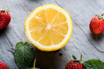 Fototapeta na wymiar Lemon and strawberries, source of vitamin C