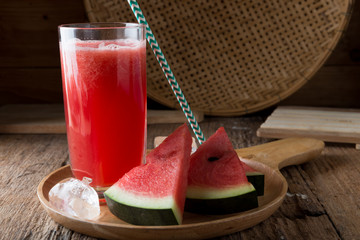 Watermelon smoothie on wood background