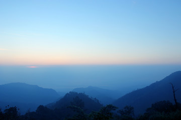 top hills and sunrise. Composition of the nature at Doi ang khang, Chiangmai Thailand , background