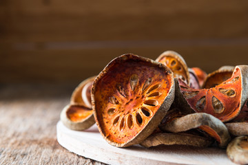 Dry Bael fruit - Slices of dry Bael fruit on the wooden table