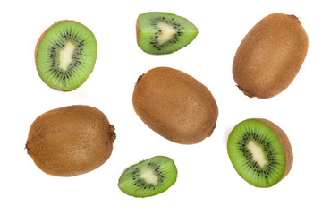Kiwi fruit with slices isolated on white background, close-up. Top view. Flat lay pattern