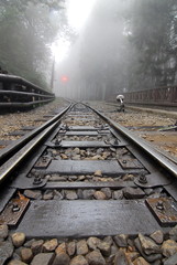 Fototapeta na wymiar The mountain fog fills the air logging-railroad