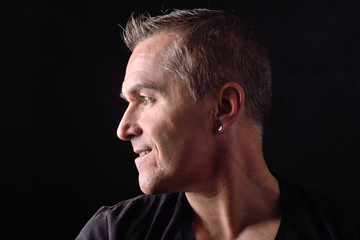 Fototapeta premium portrait of a man on black background