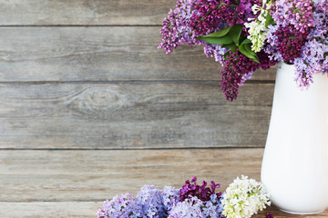 Still life with a blooming branch of lilac