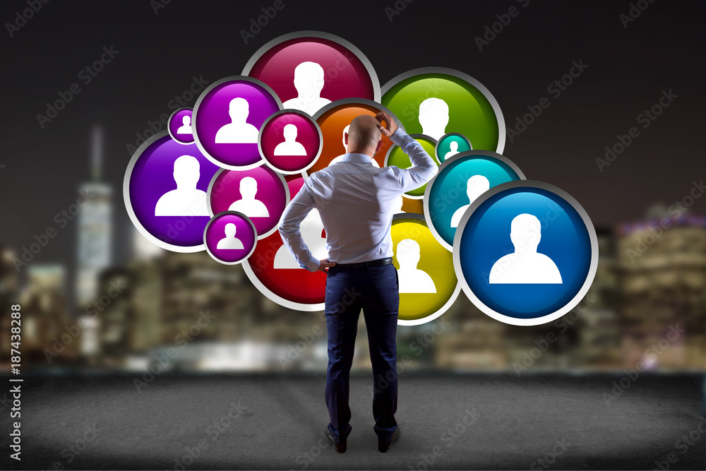 Poster businessman in front of a wall with a group of contact icon displayed on a technology interface back