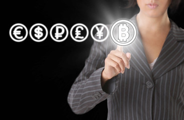 Businesswoman with Bitcoin symbol. Blockchain Transfers Concept on Black Background