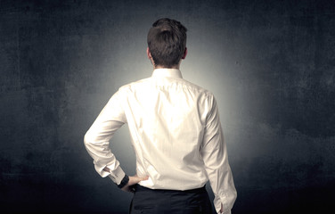 Businessman standing and thinking