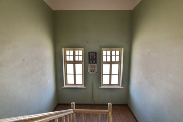 Inside view of one of the abandoned houses in the ghost town of Kolmanskop near Lüderitz in Namibia, Africa. After the diamond rush ended, the houses are slowly getting swallowed by sand and dunes.