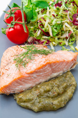 salmon fillet with sauce and mixed salad