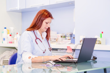     a veterinary woman in her study